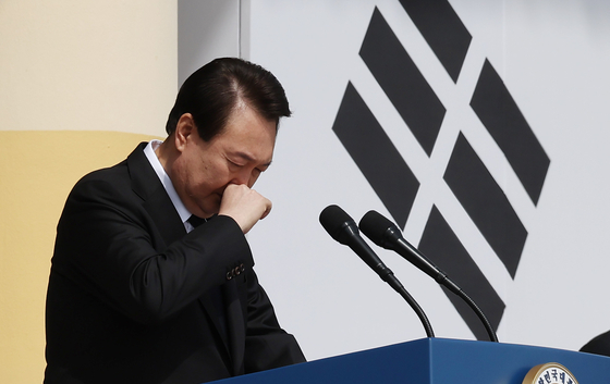 President Yoon Suk Yeol tears up ahead of his speech at a ceremony marking the eighth West Sea Defense Day soldiers at Daejeon National Cemetery on Friday. [JOINT PRESS CORPS]