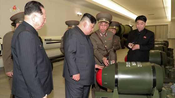 In this footage by Pyongyang’s state-controlled Korean Central Television, North Korean leader Kim Jong-un is seen inspecting what state media called the regime's arsenal of Hwasan-31 tactical nuclear warheads. [YONHAP]