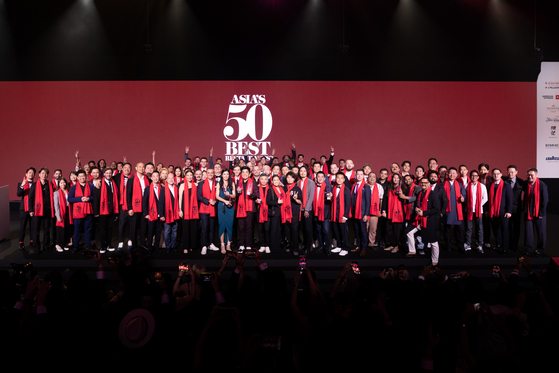 Group photo of the chefs whose restaurants have been voted on to this year’s list of Asia’s 50 Best Restaurants on Tuesday night at Resorts World Sentosa, Singapore. The 2023 list features restaurants from 19 cities and includes seven new entries. [ASIA'S 50 BEST]