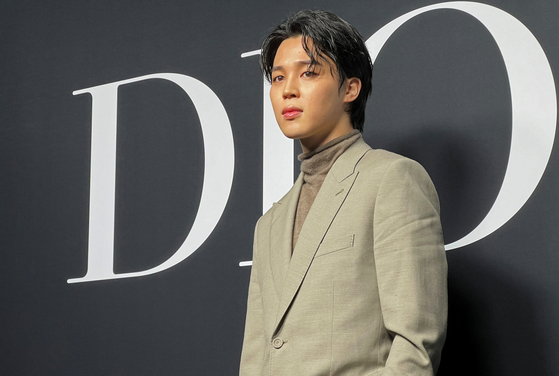 BTS's Jimin poses at a Dior Menswear ready-to-wear Fall/Winter 2023-2024 collection show on Jan. 20, during Men's Fashion Week in Paris, France. [REUTERS/YONHAP]