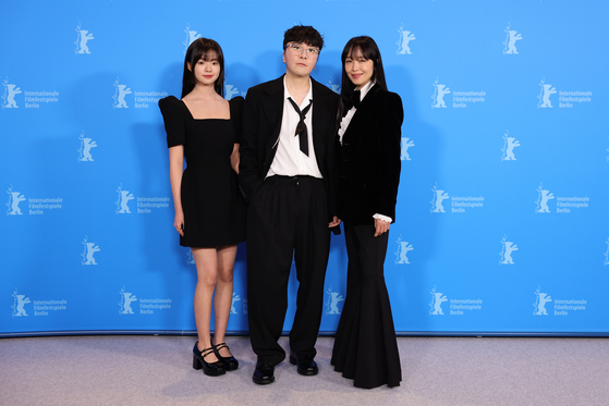 From left, actor KIm Si-a, director Byun Sung-hyun and actor Jeon Do-yeon at the Berlin Film Festival on Feb. 18. [NETFLIX]