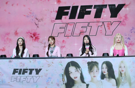 Girl group Fifty Fifty speaks during a press conference in southern Seoul’s Gangnam District on Thursday. [NEWS1]