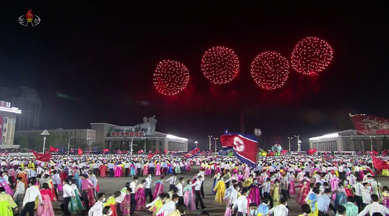 Footage from the North's state-controlled Korean Central Television shows North Koreans dancing in Kim Il Sung Square in downtown Pyongyang under fireworks marking the birth of the regime founder Kim Il Sung on Saturday evening. [YONHAP]