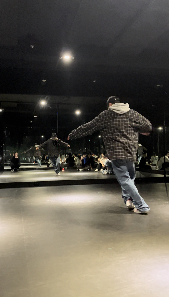 A teacher demonstrating a routine to his students at an advanced hiphop dance class. [SOFIA DEL FONSO]