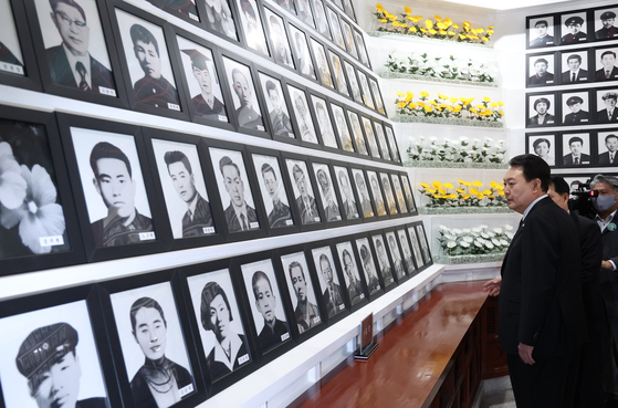 President Yoon Suk Yeol pays his respects to the martyrs of a mass pro-democracy uprising in 1960, which eventually overthrew then-President Syngman Rhee at the April 19th National Cemetery in Gangbuk District, northern Seoul on Tuesday. [JOINT PRESS CORPS]
