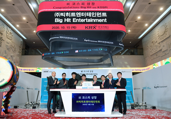 Executives of Big Hit Entertainment, now known as HYBE, pose for photos at the Korea Exchange (KRX) headquarters in Yeouido, western Seoul, on Oct. 15, 2020, the day the company went public on the KRX after seeing massive success with its boy band BTS. [JOONGANG ILBO]