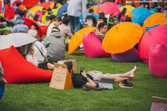 People spend a leisurely reading session on the beanbags at Reading Seoul Plaza. [SEOUL CITY OFFICIAL]