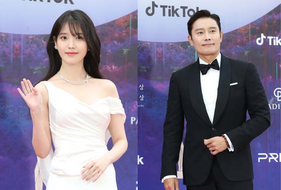 Singer IU, left, and actor Lee Byung-hun, right, attend the Baeksang Arts Awards at Paradise City in Incheon on April 28. [NEWS1]