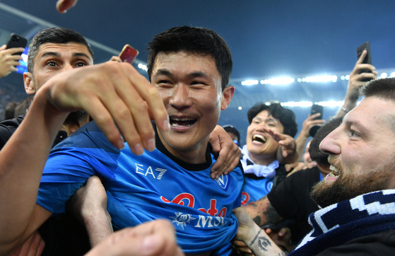 Napoli center-back Kim Min-jae celebrates with fans on the pitch in Udine, Italy after the club secured their first Serie A title in 33 years.  [REUTERS/YONHAP]