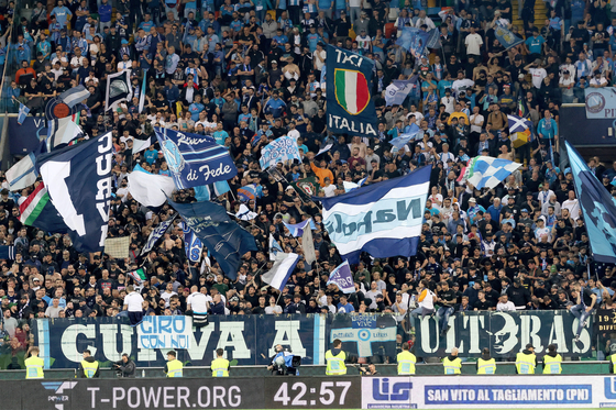 Napoli supporters celebrate after a Serie A soccer match against Udinese at the Dacia Arena in Udine, Italy on Thursday. Napoli sealed their third-ever Serie A championship with a 1-1 draw at Udinese. [EPA/YONHAP]
