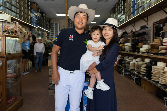 K.H. Lee, left, with his wife Yu Joo-yeon and their daughter Celine Yuna [GETTY IMAGES] 