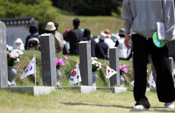People visit the May 18th National Cemetery in Gwangju on Sunday, four days ahead of the 43rd anniversary of the May 18 Gwangju Democratization Movement on Thursday. [YONHAP] 