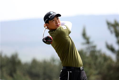 Cho Woo-young hits a shot during the Golfzon Open in Jeju at Golfzon County Ora in Jeju on April 23. [YONHAP] 