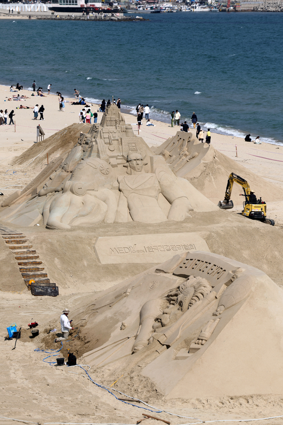 Sand castles are erected at Haeundae Beach in Busan on Monday. The 2023 Haeundae Sand Festival, themed Expo Sand Sea for the Future of 2030, will be held from Friday to Monday at Haeundae Beach and Gunam-ro Haeundae Square. [YONHAP]