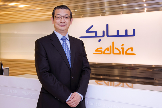 Li Lei, vice president and regional head of North Asia at SABIC, poses at an office of the Saudi company. [SABIC]