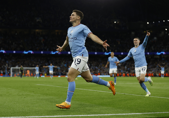 Manchester City's Julian Alvarez celebrates scoring his side's fourth goal against Real Madrid in a UEFA Champions League semifinal at the Etihad Stadium in Manchester on Wednesday.  [REUTERS/YONHAP]