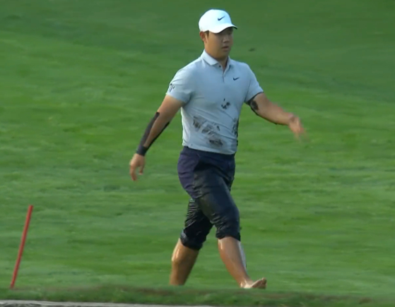 Tom Kim emerges from the creek at the Oak Hill Country Club in Rochester, New York on Thursday.  [SCREEN CAPTURE]
