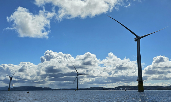 Offshore floating wind turbines at an assembly site in Gulen, southwestern Norway, on May 3, Wednesday. The turbines will be installed at the Hywind Tampen, the world's largest offshore floating wind farm. [SHIN HA-NEE]