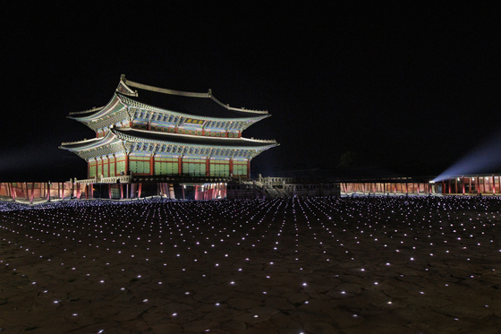 The Gyeongbok Palace's Geunjeongjeon courtyard gets lit up for the Gucci Cruise 2024 collection show on Tuesday. [GUCCI] 