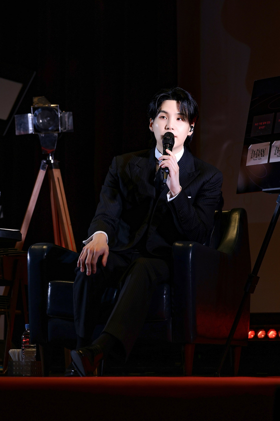 BTS member Suga talks with fans during his ″Agust D ‘D-DAY: Movie Night'″ meet and greet held Saturday in western Seoul. [BIGHIT MUSIC]