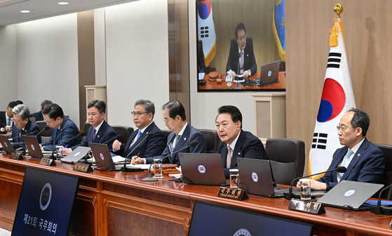 President Yoon Suk Yeol, second from right, speaks at a Cabinet meeting at the Yongsan presidential office in central Seoul on Tuesday. [JOINT PRESS CORPS]