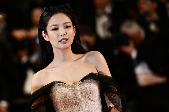 Jennie of girl group Blackpink poses for photos upon arrival at the premiere of the television series ″The Idol″ at the 76th Cannes International Film Festival held in Cannes, France, on Tuesday. [AP/YONHAP]