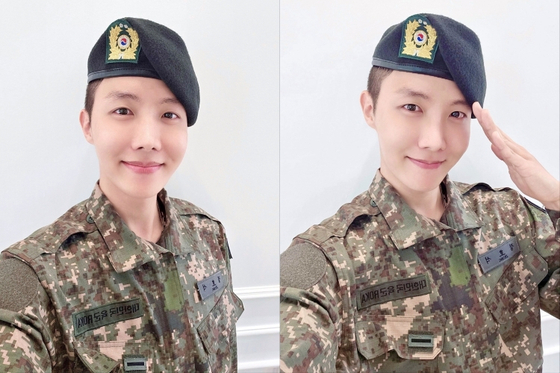 J-Hope of boy band BTS takes selfies after finishing his five-week basic military training on Wednesday. [WEVERSE]