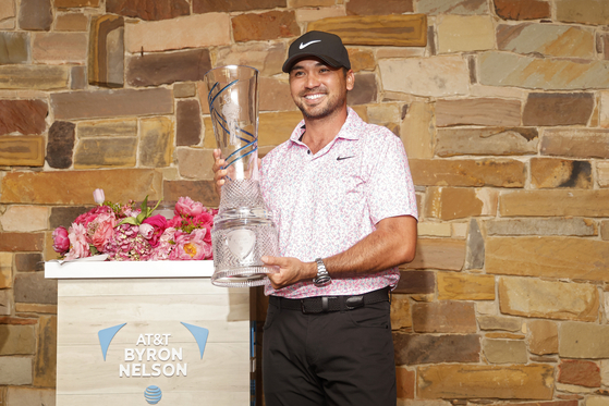 Jason Day poses for a photo with the trophy after winning the AT&T Byron Nelson at TPC Craig Ranch in McKinney, Texas, on May 14. [GETTY IMAGES] 