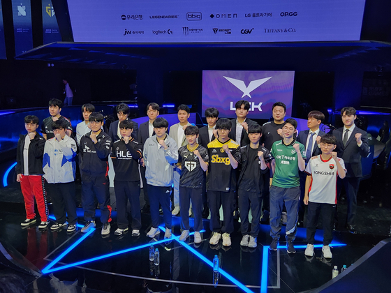 Ten teams competing at the 2023 League of Legends Champions Korea Summer Split pose for a photo at a press event in the League of Legends Esports Stadium in Jung District, central Seoul, on Thursday. [NEWS1]