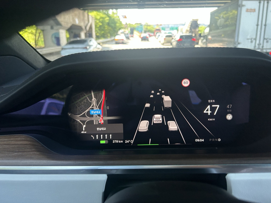 With eight cameras around the car, Tesla's Autopilot system shows a live graphic of cars, lanes and humans [SARAH CHEA] 