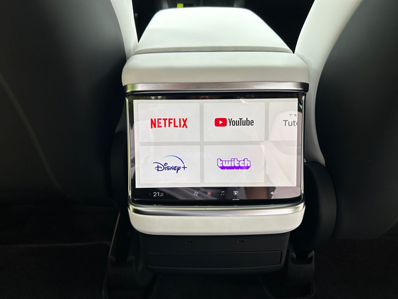 A smaller screen is also placed in the back seat, allowing passengers in the second and third rows to watch content. [SARAH CHEA]