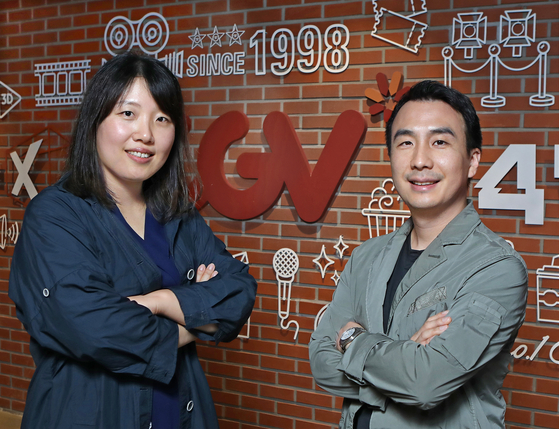 4DX producer at CGV Lee Ji-hye, left, and ScreenX producer Oh Yoon-dong pose for a photo at the CGV Yongsan office in central Seoul on May 16. [PARK SANG-MOON]