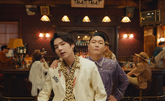 Suga in the music video for singer Psy's "That That" (2022). The song was produced by Suga and features his rap. [SCREEN CAPTURE]