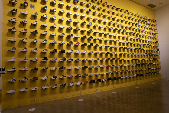 "Our Wall" consists of 364 unique sneakers lent by sneakerhead collectors, including from brands Nike, New Balance and Vans. [SEJONG CENTER FOR THE PERFORMING ARTS]