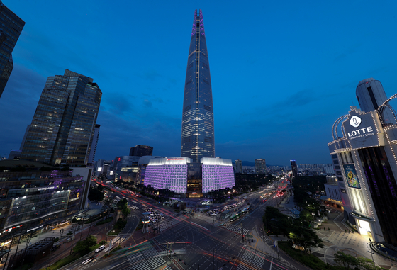 Lotte World Tower in southern Seoul is lit in purple on June 12, as part of the ″2023 BTS Festa″ held in celebration of K-pop boy band BTS's 10th anniversary of debut. [YONHAP]