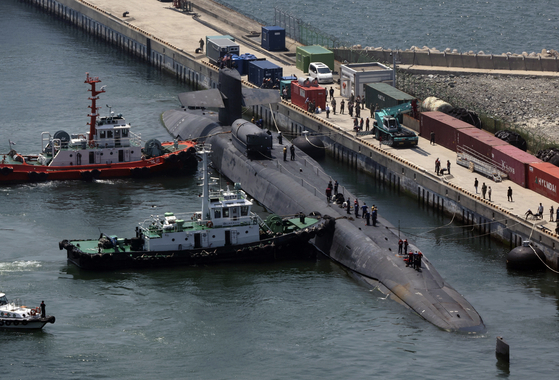 The nuclear-powered guided missile submarine USS Michigan docks in Busan on Friday. [YONHAP]