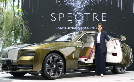 Irene Nikkein, regional director for the Asia-Pacific region at Rolls-Royce Motor Cars, poses for a photo beside the all-electric Spectre coupe in Gangnam District, southern Seoul, Friday. [NEWS1] 
