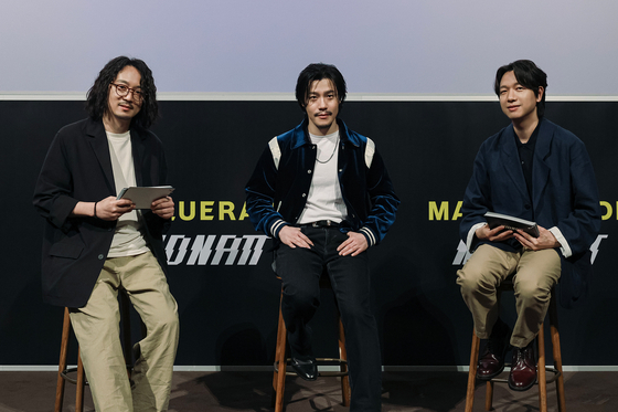 Singer Lee Hyun, center, who recently released a new song "Masquerade" with the help of artificial intelligence (AI) on May 15 during a press conference on the same day. [HYBE] 