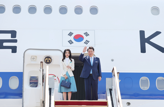 President Yoon Suk Yeol and first lady Kim Keon-hee depart on the presidential jet at Seoul Air Base in Gyeonggi, kicking off a weeklong, two-country trip to France and Vietnam on Monday. [JOINT PRESS CORPS]