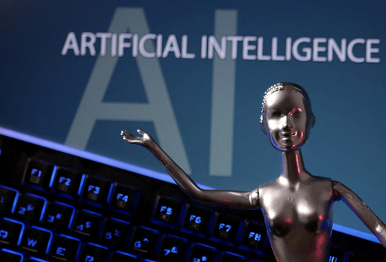 AI Artificial Intelligence words are seen in this illustration taken, May 4. [REUTERS/YONHAP] 