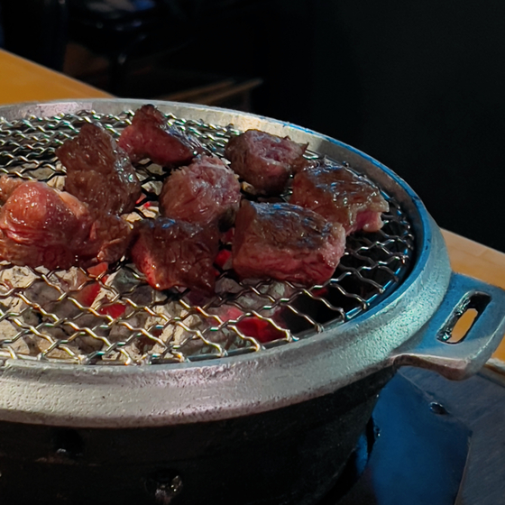 A small charcoal grill is given to each customer at 889 Sangdo, with which customers grill the meat by themselves. [LEE TAE-HEE]