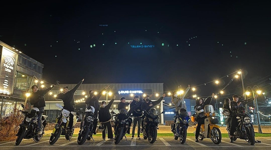 Members of Sejong Riders pose with their motorbikes during a regular monthly trip to Jamsu Bridge in southern Seoul. [SCREEN CAPTURE]