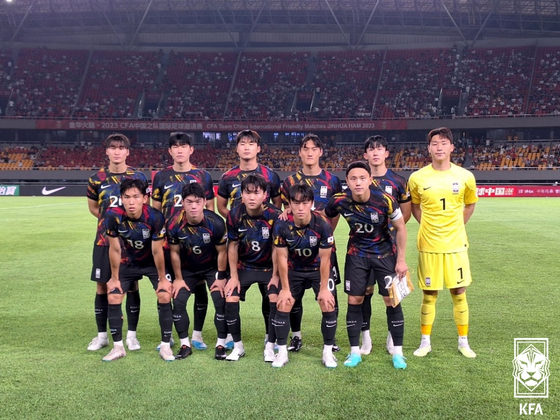 The Korean U-24 team poses for a photo ahead of a friendly against China at Jinhua Sports Centre Stadium in Jinhua, China on Monday. [KOREA FOOTBALL ASSOCIATION]