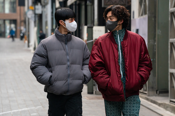 Actors Woo Do-hwan, left, as Geon-woo, and Lee Sang-yi as Woo-jin, in the Netflix series ″Bloodhounds″ [NETFLIX]