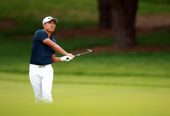 C.T. Pan of Chinese Taipei hits his second shot on the second hole during the final round of the RBC Canadian Open at Oakdale Golf & Country Club on Sunday in Toronto, Canada. [GETTY IMAGES]