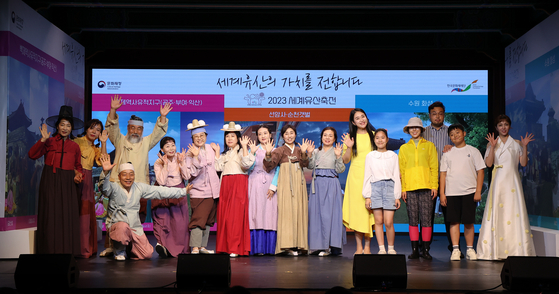 Performers for the Suncheon and Suwon legs of the 2023 World Heritage Festival pose during a press conference in central Seoul on Wednesday. [CULTURAL HERITAGE ADMINISTRATION]