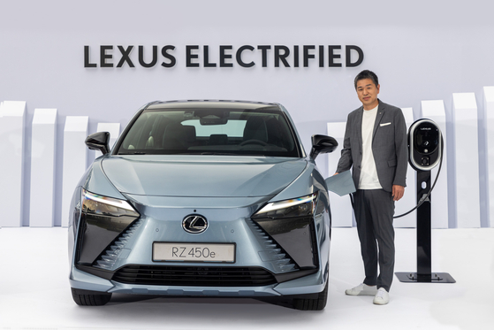Takashi Watanabe, president of Lexus International, poses with the RZ 450e at a press event Wednesday in southern Seoul. [TOYOTA MOTOR KOREA]