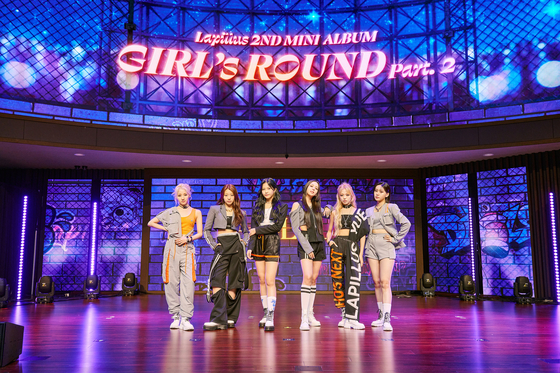 Girl group Lapillus poses for a photo during a showcase on Wednesday at the Sky Art Hall in Gangseo District, western Seoul. [MLD ENTERTAINMENT]