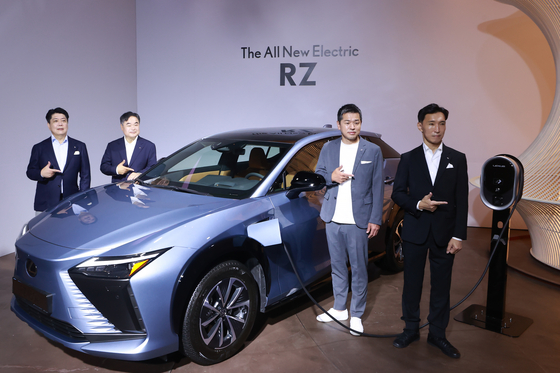 Officials from Lexus International pose at a Lexus press event in Jamsil, southern Seoul, on Wednesday. [YONHAP]