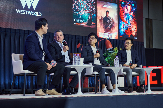 Netflix co-CEO Ted Sarandos, second from left, speaks during a meeting with production company representatives at an open talk session held at Four Seasons Hotel in Jung District, central Seoul, on Thursday. [NETFLIX]
